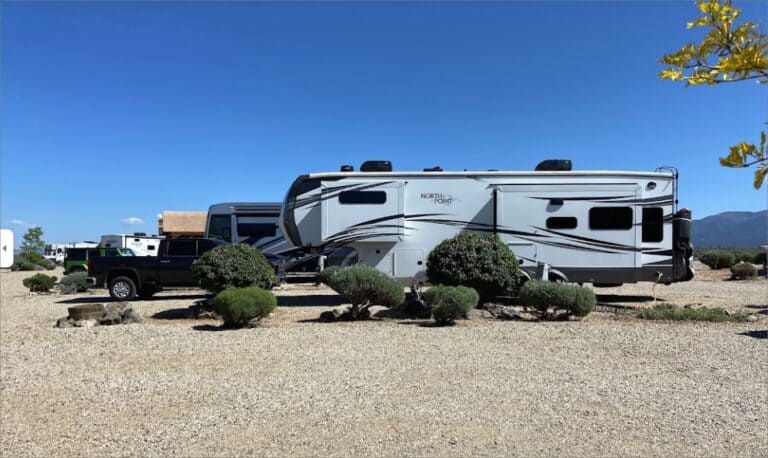 A group of RVs parked in the Taos Monte Bello RV Park.