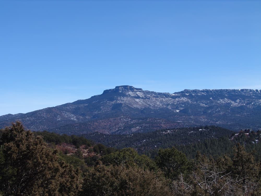 A mountain range with trees in the background at Fishers Peak State Park.