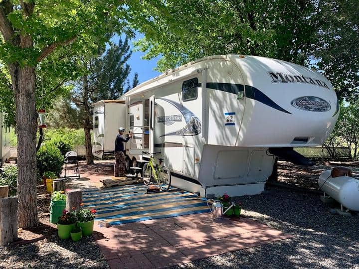 A white RV parked at Sundowner Mobile Home & RV Park.