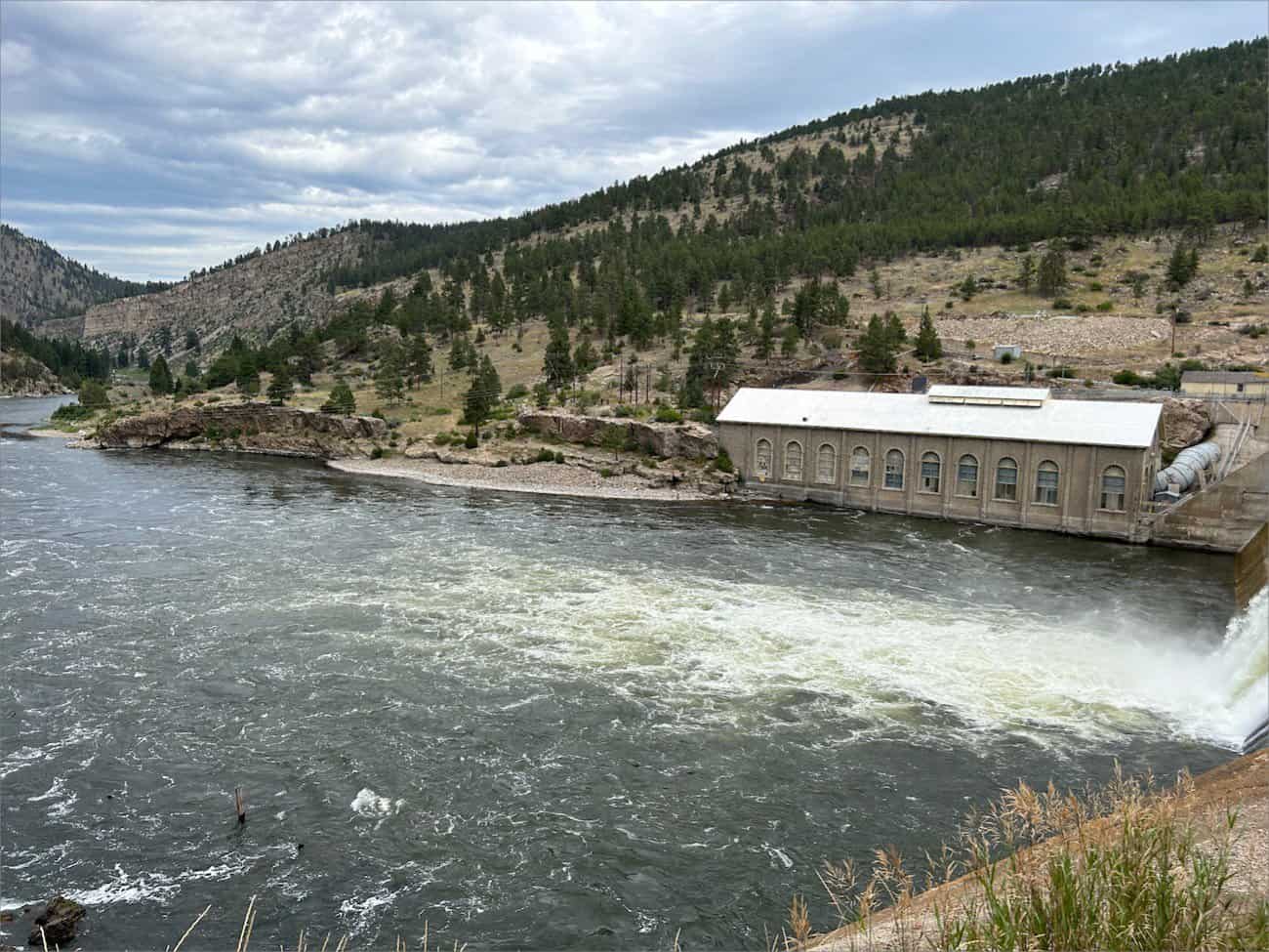 Hauser Dam - A hydroelectric power station on a river with rapidly flowing water in a mountainous landscape at Black Sandy State Park.